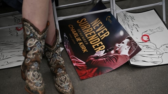 A poster with a portrait of slain conservative commentator Charlie Kirk lies on the ground, on the day of a memorial service for him, at State Farm Stadium, in Glendale, Arizona, U.S., September 21, 2025. REUTERS/Callaghan O'Hare(REUTERS)