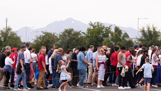 People queue outside to attend a memorial service for slain conservative commentator Charlie Kirk at State Farm Stadium, in Glendale, Arizona, U.S., September 21, 2025. REUTERS/Cheney Orr(REUTERS)