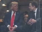 President Donald Trump, left, and Elon Musk talk during a memorial for Charlie Kirk, Sunday, Sept. 21, 2025, at State Farm Stadium in Glendale, Ariz. (AP Photo/Ross D. Franklin)