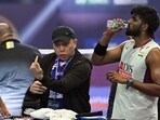 File picture of Satwiksairaj Rankireddy and Chirag Shetty with coach Tan Kim Her. (HT file photo)