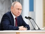 Russian president Vladimir Putin attends a meeting.