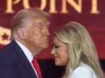 US President Donald Trump embraces Erika Kirk, during a memorial service for her husband, slain conservative commentator Charlie Kirk.