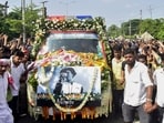 People gather around the vehicle carrying the mortal remains of singer Zubeen Garg as they are taken to his residence from Guwahati airport, Sunday, Sept. 21, 2025.