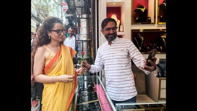 A man clicks a selfie with BJP MP Kangana Ranaut during her interaction with people on GST reforms, in Mandi on Monday. (ANI)