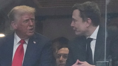 President Donald Trump and Elon musk talk during a memorial for Charlie Kirk, Sunday, Sept. 21, 2025, at State Farm Stadium in Glendale, Ariz. (AP/PTI) (AP09_22_2025_000017A) (AP) President Donald Trump and Elon musk talk during a memorial for Charlie Kirk, Sunday, Sept. 21, 2025, at State Farm Stadium in Glendale, Ariz. (AP/PTI) (AP09_22_2025_000017A) (AP)
