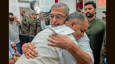 Bollywood actor Nana Patekar hugs a man during an event in Rajouri, Jammu and Kashmir, on Monday. (PTI)