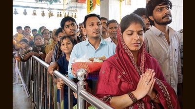 Devotees queue up to offer prayers on the first day of Navratri at Mata Mansa Devi Temple in Panchkula on Monday. (Sant Arora/HT)