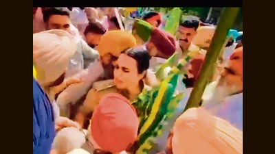 Nabha DSP Mandeep Kaur Cheema trying to pacify protesting farmers outside her office on Monday. (Video grab) Nabha DSP Mandeep Kaur Cheema trying to pacify protesting farmers outside her office on Monday. (Video grab)