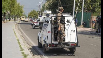Security personnel patrol an area after a suspected explosive material was detected on the banks of the Dal Lake in Srinagar on Monday. (PTI)