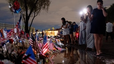 Mourners visit a tribute for slain conservative commentator Charlie Kirk at the headquarters of Turning Point USA, in Phoenix, Arizona. (Cheney Orr/REUTERS)