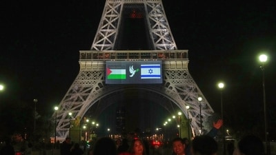 A large screen displays Palestinian and Israeli flags and a dove on the Eiffel Tower, Sunday, Sept. 21, 2025 in Paris, as France prepares to formally recognize a Palestinian state at the United Nations General Assembly. (AP/PTI) (AP) A large screen displays Palestinian and Israeli flags and a dove on the Eiffel Tower, Sunday, Sept. 21, 2025 in Paris, as France prepares to formally recognize a Palestinian state at the United Nations General Assembly. (AP/PTI) (AP)