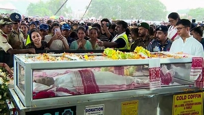 People gather to pay tribute as the mortal remains of Assamese singer Zubeen Garg brought at Arjun Bogeshwar Baruah Sports Complex, in Guwahati on Sunday. (ANI Video Grab) People gather to pay tribute as the mortal remains of Assamese singer Zubeen Garg brought at Arjun Bogeshwar Baruah Sports Complex, in Guwahati on Sunday. (ANI Video Grab)