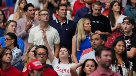 Visitors attend Charlie Kirk's memorial service at State Farm Stadium in Glendale, Arizona on Sunday.(Julia Demaree Nikhinson/AP)