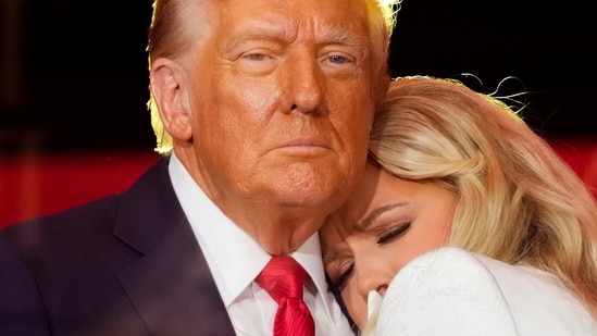 Erika Kirk, Charlie Kirk's widow hugs President Donald Trump at the end of the memorial service in Arizona on Sunday.(Julia Demaree Nikhinson/AP)