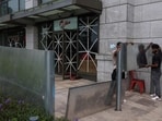 Workers install waterproof steel plates to protect against flooding from Super Typhoon Ragasa, in Hong Kong, China, September 23, 2025.