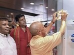 Chief minister Yogi Adityanath pasting an awareness sticker on GST reforms in Gorakhpur on Monday. (PTI PHOTO) Chief minister Yogi Adityanath pasting an awareness sticker on GST reforms in Gorakhpur on Monday. (PTI PHOTO)