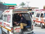 FILE - An ambulance transports injured blast victims outside the police headquarters in Peshawar. (Photo by Abdul MAJEED / AFP)