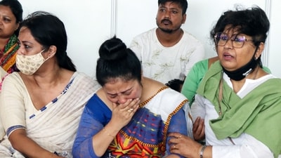 Garima Saikia, wife of Assamese singer Zubeen Garg, mourns during the last rites of her husband at Sarusajai Stadium, in Guwahati on Monday. (ANI) Garima Saikia, wife of Assamese singer Zubeen Garg, mourns during the last rites of her husband at Sarusajai Stadium, in Guwahati on Monday. (ANI)
