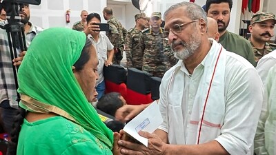 Nana Patekar disburses rehabilitation aid to a family member, affected by loss of life and property due to Pakistani shelling on civilian areas during Operation Sindoor, in Rajouri, Jammu and Kashmir, Monday, Sept. 22, 2025. (PTI Photo) (PTI)
