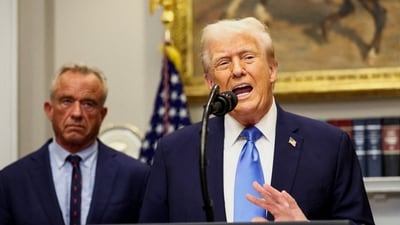 U.S. President Donald Trump, next to U.S. Secretary of Health and Human Services Robert F. Kennedy Jr., makes an announcement linking autism to childhood vaccines and to the use of popular pain medication Tylenol for pregnant women and children. (REUTERS)