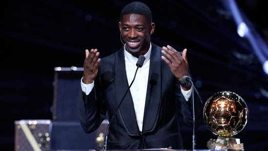 Paris Saint-Germain's French forward Ousmane Dembele speaks after receiving the Ballon d'Or. (AFP)