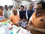 CM Yogi Adityanath at the Universal Booksellers in Hazratganj on Wednesday. (HT) CM Yogi Adityanath at the Universal Booksellers in Hazratganj on Wednesday. (HT)