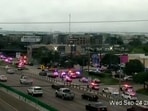 Police cars and ambulances stand outside a ICE facility where a shooting took place in Dallas, Texas, U.S. September 24, 2025 in this screengrab taken from a handout traffic camera video.