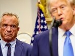 U.S. Secretary of Health and Human Services Robert F. Kennedy Jr. looks at U.S. President Donald Trump while he makes an announcement linking autism to childhood vaccines and to the use of popular pain medication Tylenol for pregnant women and children, claims which are not backed by decades of science, at the White House, in Washington, D.C., U.S., September 22, 2025. REUTERS/Kevin Lamarque