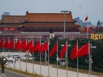 Flags flutter near Tiananmen Square ahead of the 80th anniversary of the end of World War Two, on Qianmen Street in Beijing, China, August 26, 2025. REUTERS/Tingshu Wang