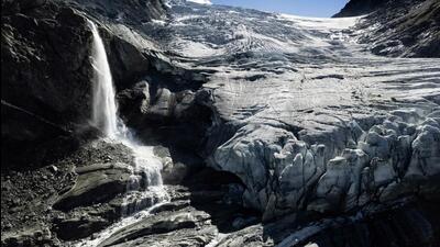 A drone view shows water from melting ice running down the side of the Turtmann glacier on a warm summer day, amid climate change, in Turtmann, Switzerland on September 3. (REUTERS) A drone view shows water from melting ice running down the side of the Turtmann glacier on a warm summer day, amid climate change, in Turtmann, Switzerland on September 3. (REUTERS)