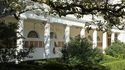 "The presidential walk of fame" is written on a wall, above pieces of brown paper placed in the colonnade outside the Oval Office (REUTERS)