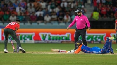 Mustafizur Rahman, left, successfully run out India's Abhishek Sharma, right, during the Asia Cup cricket match between India and Bangladesh (AP) Mustafizur Rahman, left, successfully run out India's Abhishek Sharma, right, during the Asia Cup cricket match between India and Bangladesh (AP)