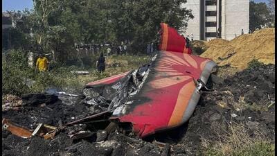 In this June 12 photo, charred remains of the Air India plane, that crashed into a medical hostel and its canteen complex moments after taking off from the SVPIA lie on the ground, in Ahmedabad. (PTI) In this June 12 photo, charred remains of the Air India plane, that crashed into a medical hostel and its canteen complex moments after taking off from the SVPIA lie on the ground, in Ahmedabad. (PTI)