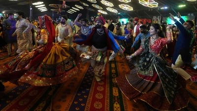 Dr Krunal cautions against painkillers during Garba, highlighting their kidney risks when dehydrated. (AP Photo/Ajit Solanki) Dr Krunal cautions against painkillers during Garba, highlighting their kidney risks when dehydrated. (AP Photo/Ajit Solanki)