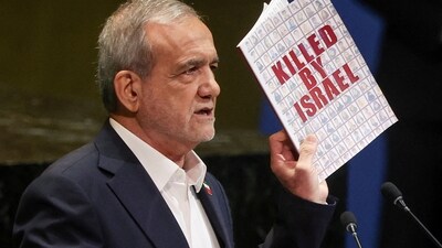 Iran's President Masoud Pezeshkian holds up a book as he addresses the 80th United Nations General Assembly (UNGA) at the UN headquarters in New York, U.S., September 24, 2025. (REUTERS)