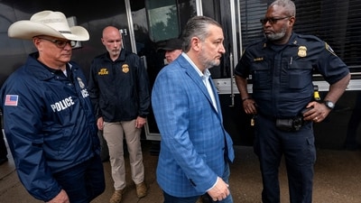 US Senator Ted Cruz leaves a press conference with Immigration and Customs Enforcement acting field office director Joshua Johnson at the scene of a shooting at an ICE field office in Dallas, Texas. (REUTERS)