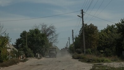 Military trucks on an unpaved road in the Donetsk region of Ukraine. (Agency) Military trucks on an unpaved road in the Donetsk region of Ukraine. (Agency)