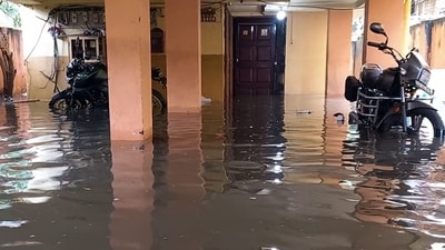 A view of a waterlogged parking area with partially submerged vehicles after heavy rainfall, in Kolkata (ANI ) A view of a waterlogged parking area with partially submerged vehicles after heavy rainfall, in Kolkata (ANI )
