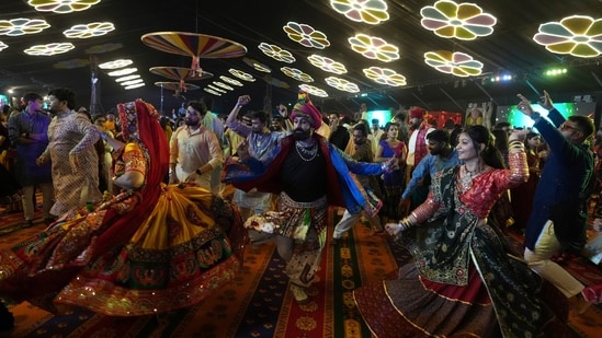 People wearing traditional attire perform Garba, a traditional dance of Gujarat state, on the first night of Navratri, or nine night festival, in Ahmedabad, India, Monday, Sept. 22, 2025. (AP)