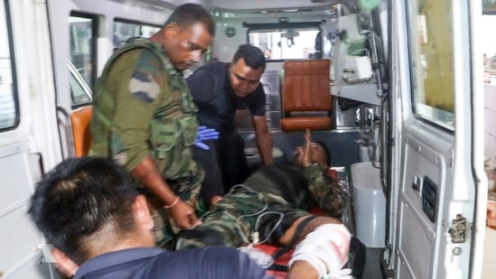 An injured security personnel being taken to the Regional Institute of Medical Sciences hospital after a terrorist attack on an Assam Rifles vehicle in Nambol Sabal area of Bishnupur, in Imphal on Friday. Reportedly, two Assam Rifles personnel, including one JCO and one jawan, killed in the ambush. (ANI)