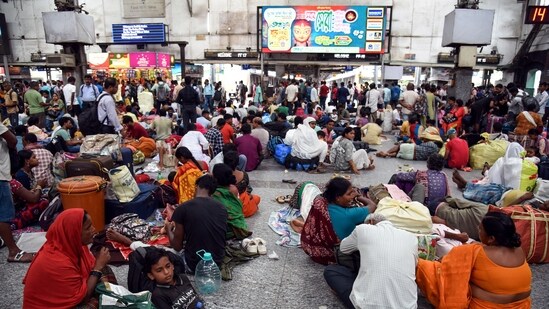 Passengers waiting on the platform as the Sealdah South section train is being cancelled due to the heavy rain, in Kolkata.(Debajyoti Chakraborty /ANI)