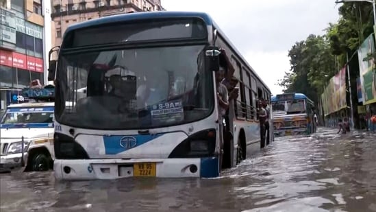 A view of a bus on a waterlogged road after heavy rainfall at Rabindra Sadan, in Kolkata, on Tuesday, September 23(ANI )