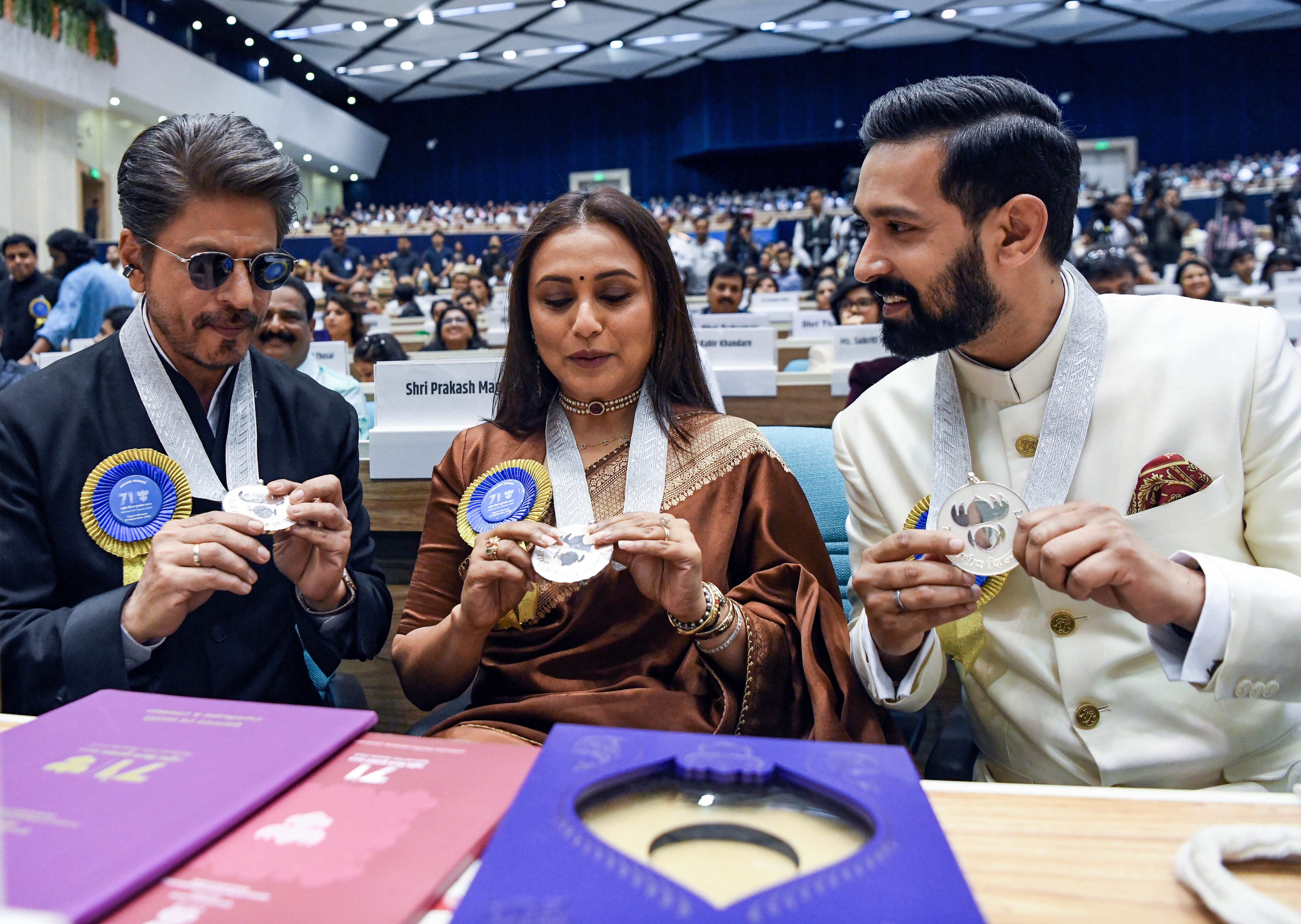 New Delhi, Sep 23 (ANI): Actors Shah Rukh Khan, Rani Mukerji, and Vikrant Massey with their National Film Awards at the 71st National Film Awards at Vigyan Bhawan, in New Delhi, on Tuesday (ANI Photo/Rahul Singh). (Rahul Singh ) New Delhi, Sep 23 (ANI): Actors Shah Rukh Khan, Rani Mukerji, and Vikrant Massey with their National Film Awards at the 71st National Film Awards at Vigyan Bhawan, in New Delhi, on Tuesday (ANI Photo/Rahul Singh). (Rahul Singh )