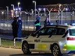 Police officers stand guard after all traffic was closed at the Copenhagen Airport due to drone reports on September 22, 2025.