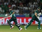 Pakistan's captain Salman Agha, right, and Pakistan's Mohammad Haris run between the wickets
