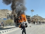 A vehicle is set on fire during a protest by locals demanding statehood for the federal territory and job quotas for local residents in Leh, in the Ladakh region, India, September 24, 2025. 