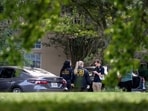 Law enforcement personnel gather outside the Fairview, Texas home of Joshua Jahn, the suspected gunman in a fatal shooting