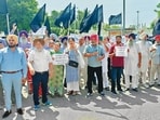 The residents affected by the steep enhancement charges protesting against GMADA and Punjab government near Sohana gurdwara on Airport Road in Mohali on Tuesday. (HT Photo) The residents affected by the steep enhancement charges protesting against GMADA and Punjab government near Sohana gurdwara on Airport Road in Mohali on Tuesday. (HT Photo)