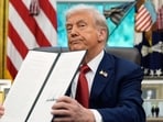 President Donald Trump holds a signed executive order regarding TikTok in the Oval Office at the White House President Donald Trump holds a signed executive order regarding TikTok in the Oval Office at the White House