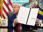 President Donald Trump holds a signed executive order regarding TikTok in the Oval Office at the White House, Thursday, Sept. 25, 2025, in Washington. President Donald Trump holds a signed executive order regarding TikTok in the Oval Office at the White House, Thursday, Sept. 25, 2025, in Washington.